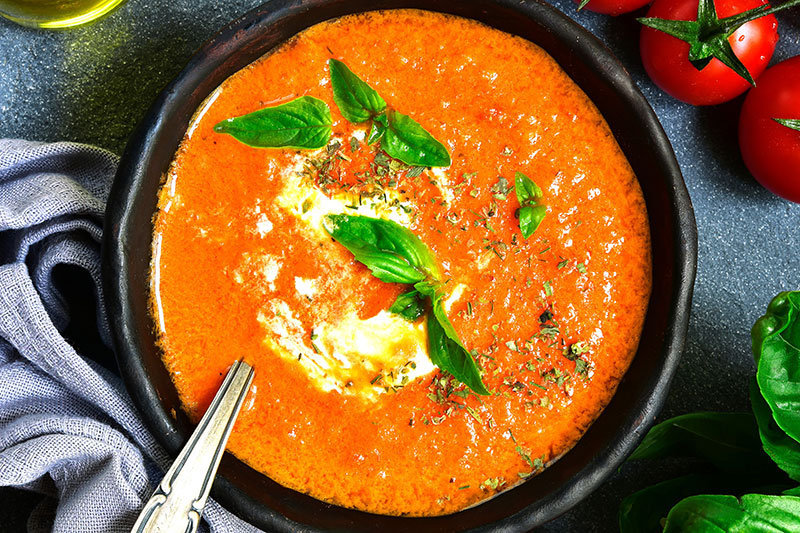 Roasted Red Pepper Soup in Black Bowl